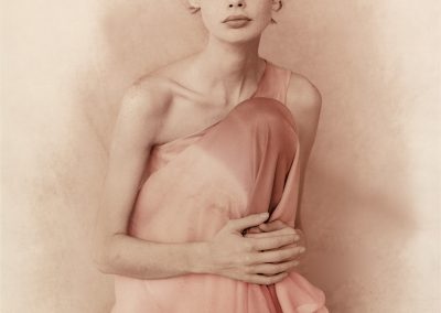 photo of short haired lady wearing pink gown