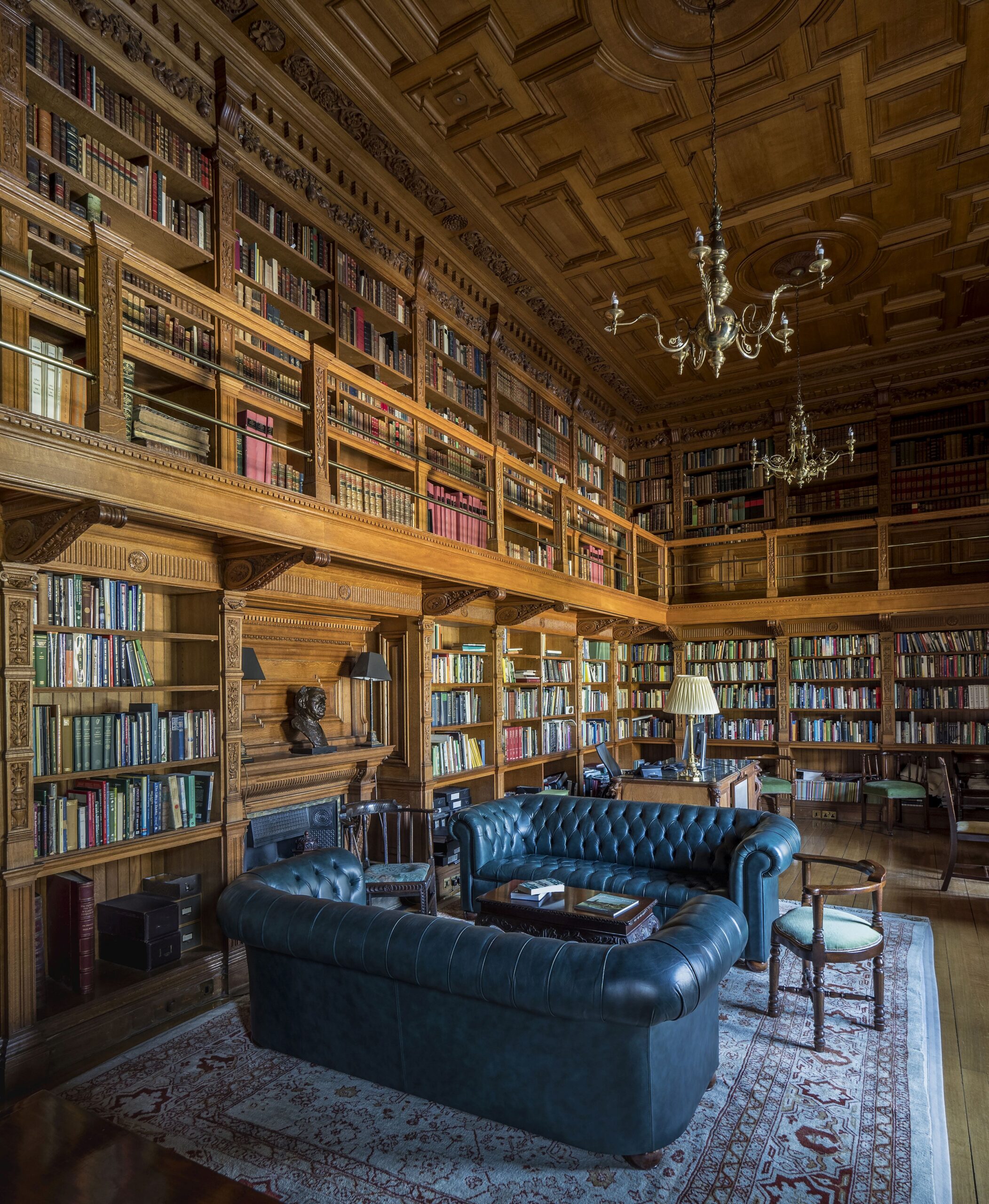 bookshelves in Farmleigh library and green leather couches